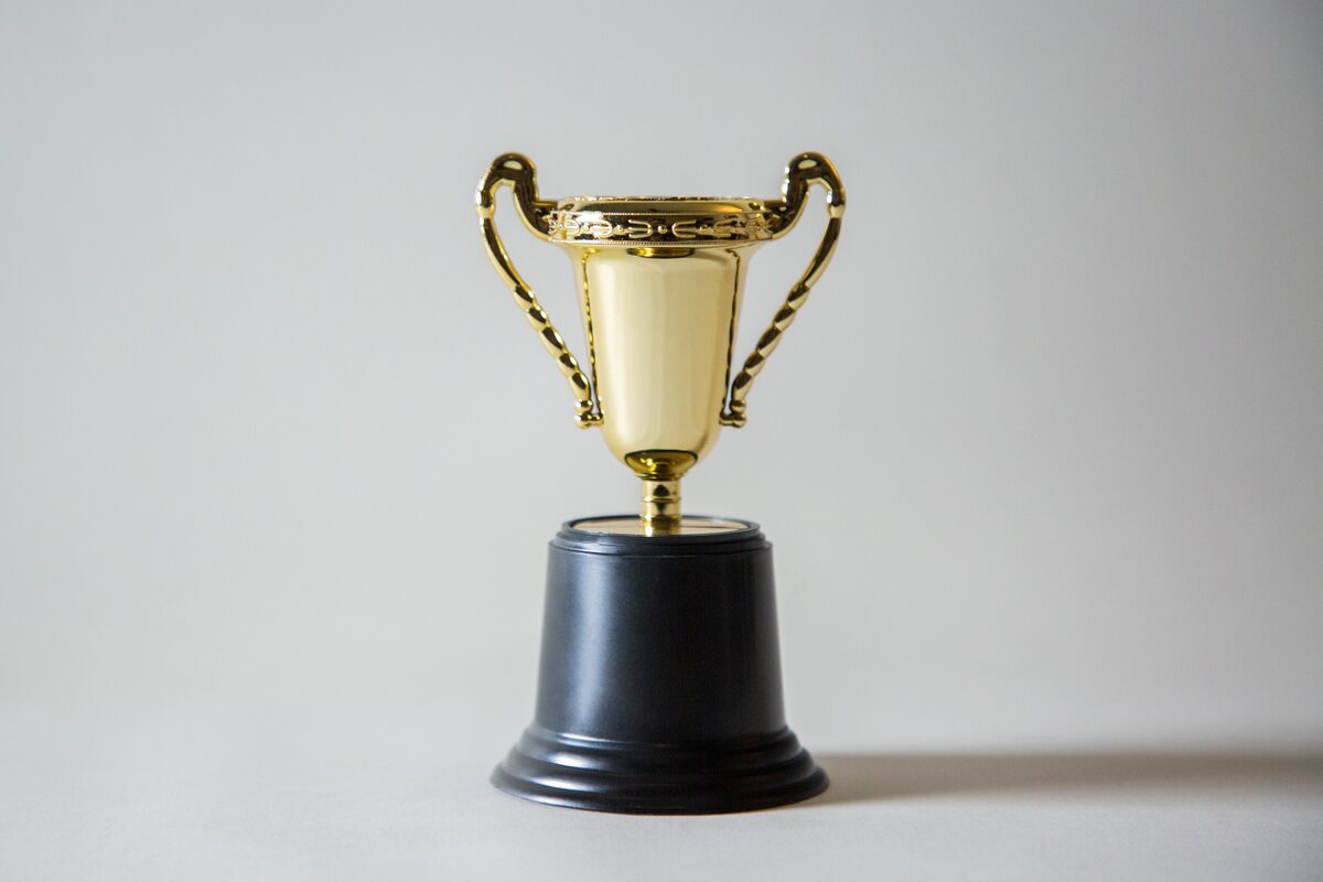 A gold trophy representing Magic Rewards